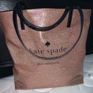 Rose gold sparkly Kate Spade bag.